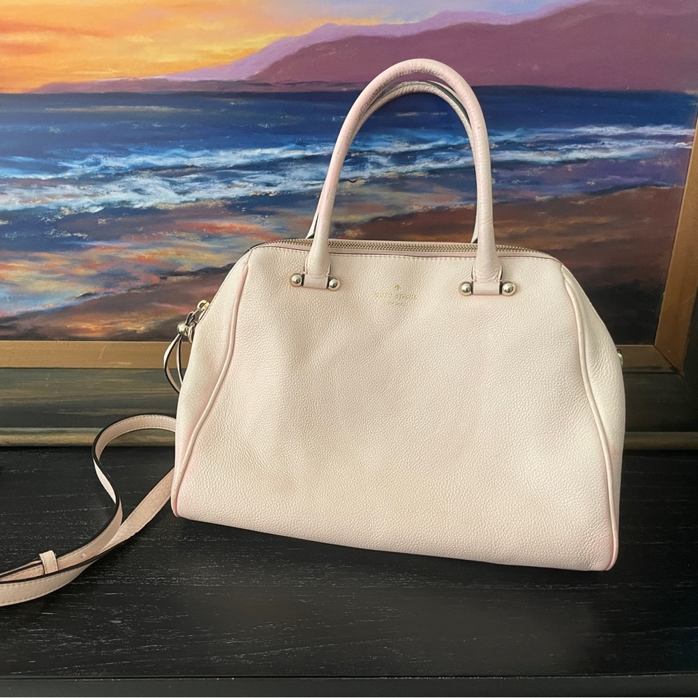 Beautiful gently used Kate Spade bag. Featuring pink pebbled leather.